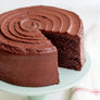 Daisy's Chocolate Cake - Chocolate cake with a slice removed on a blue plate