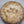 Chicken pot pie with a decorative crust in a cardboard box