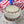 White cake with red and blue sprinkles on a marble surface